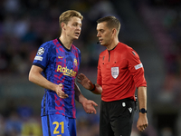 Referee Clement Turpin and Frenkie de Jong of Barcelona talks during the UEFA Champions League group E match between FC Barcelona and Dinamo...