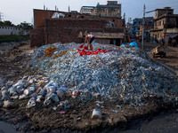 Aug. 9, 2015 - Dhaka, Bangladesh - A tannery worker collects pieces of cattle skin after sundry. (