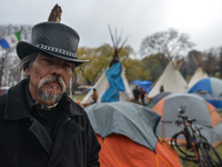 Johnny Lee of Driftpile First Nation, seen inside a 'sit-in' camp that consists of five teepees, a dozen tents and a sacred fire, set in the...