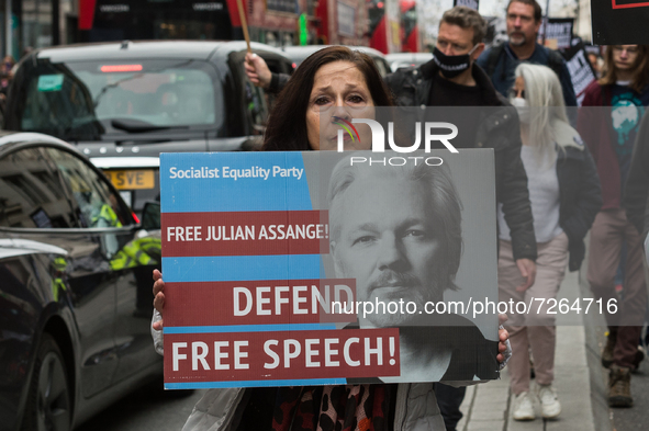 LONDON, UNITED KINGDOM - OCTOBER 23, 2021: Demonstrators march through central London in solidarity with Julian Assange ahead of next week's...