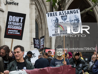 LONDON, UNITED KINGDOM - OCTOBER 23, 2021: Demonstrators take part in a rally outside the Royal Courts of Justice in solidarity with Julian...