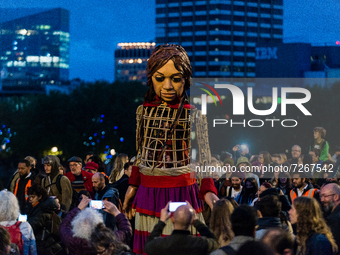'Little Amal', a giant puppet depicting a Syrian refugee girl, walks through Waterloo Bridge in London, Britain, 23 October 2021. A giant do...