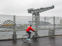A cyclists crosses the Clyde Arc Bridge overlooking the Scottish Event Campus on September 1, 2021 in Glasgow, Scotland. The Scottish Event...