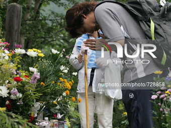 Relatives of the victims of the 1985 Japan Airlines jumbo jet crash pray in front of the victims' monument at Osutaka Ridge north of Tokyo,...