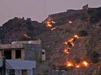 A view of Nahargarh hills during the wild dry grass catch fire, in Jaipur , Rajasthan, India, Oct 28,2021. (