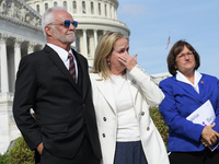 Captain Lee Rosbach(left), US Representatives Madeleine Dean(D-PA)(center) and Annie Kuster(D-NH)(right) during a press conference about com...