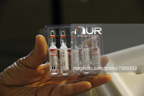 A nurse shows a  Sputnik V dose vaccine during a mass vaccine campaign  against Covid19, ending the supply of vaccines to people over 18 yea...