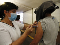 A person receives  a  Sputnik V dose vaccine during a mass vaccine campaign  against Covid19, ending the supply of vaccines to people over 1...
