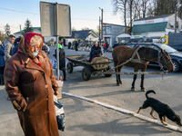 People in medical masks and without masks on the market square in the town of Ulaniv, Ukraine. October 2021 Daily life in Ukraine amid the o...