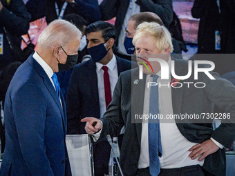 Joe Biden, left, President of the United States and Boris Johnson, right, Prime Minister of the United Kingdom talk during the celebration o...