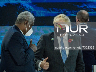 Boris Johnson, right, Prime Minister of the United Kingdom, with Moussa Faki, President of The African Union Commission, left, in the G20 Su...