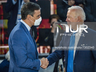 Pedro Sanchez, left, President of Spain, salutes Joe Biden, right, President of the United States, in the G20 Summit of Heads of State and G...