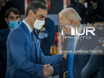 Pedro Sanchez, left, President of Spain, shakes hands with Joe Biden, right, President of the United States, in the G20 Summit of Heads of S...