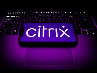 Citrix logo displayed on a phone screen and a laptop keyboard are seen in this illustration photo taken in Krakow, Poland on October 30, 202...