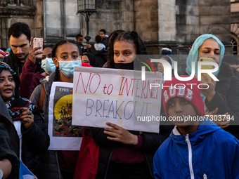 Demonstrators gather at a square on High Street (known as Royal Mile) holding placards and flags to protest against a military coup in Sudan...