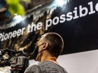 A cameraman in Swedish Pavilon at the COP26 UN Climate Change Conference, held by UNFCCC inside the COP26 venue - Scottish Event Campus in G...