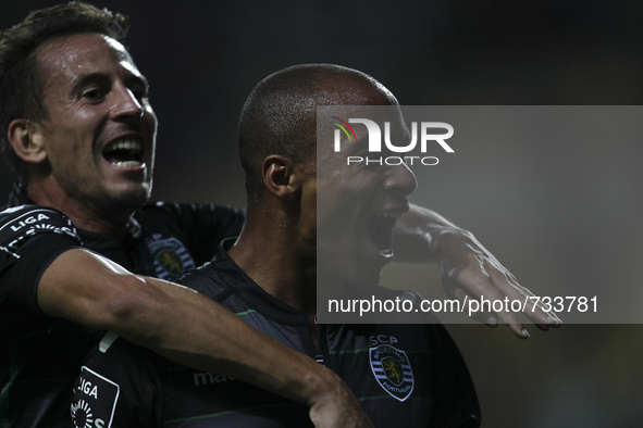 Sporting's Portuguese midfielder João Mário celebrates after scoring a goal during the Premier League 2015/16 match between CD Tondela and S...