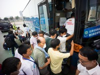 Refugees boarding the bus to evacuat from the temporary refugees camp as local authority confirmed there are toxic gas in the surrounding ar...