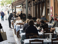 People seen sited in a restaurant at the enter of a shop in the center of Athens, Greece on November 10, 2021. Mandatory negative Coronaviru...