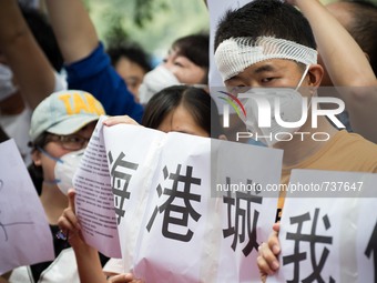 An injured resident seen in the protest. - Hundreds of residents from near the chemical explosion zone of Tianjin protested at the Mayfair H...