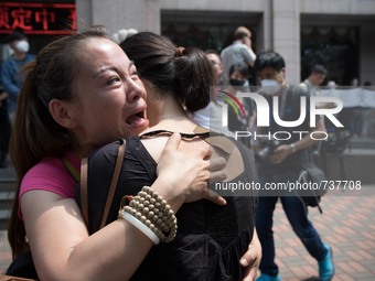Females protesters comforting each other seen at the protest outside the Mayfair hotel. - Hundreds of residents from near the chemical explo...