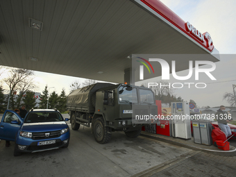 A military truck is seen being refueled at an Orlen gas station on 13 November, 2021 near  Sokolka, Poland. This week Belarus sent over a th...