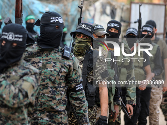 Members of Ezzedine al-Qassam Brigades, military wing of the Palestinian Hamas movement, take part in a parade in Gaza City on November 14,...