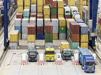 Barcelona, Catalonia, Spain. August 18. Trucks and containers of goods at the port of Barcelona Freight. File image of June 6, 2014. (