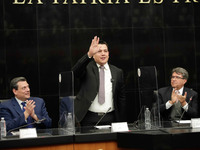 Trainer Eddy Reynoso,  salutes accompanied by Mauricio Sulaimán (L), president of the World Boxing Council (WBC) and The president of the Po...