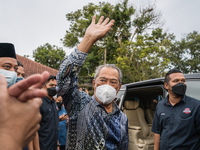 Pakatan Nasional Chairman Muhyiddin Yassin raised his hand during a walkabout to promote his party and candidate at Gadek, Malacca, Malaysia...