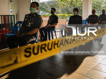 Police personnel queuing up to cast their ballots during early voting for Malacca State Election at  Malacca Police Headquarters on November...