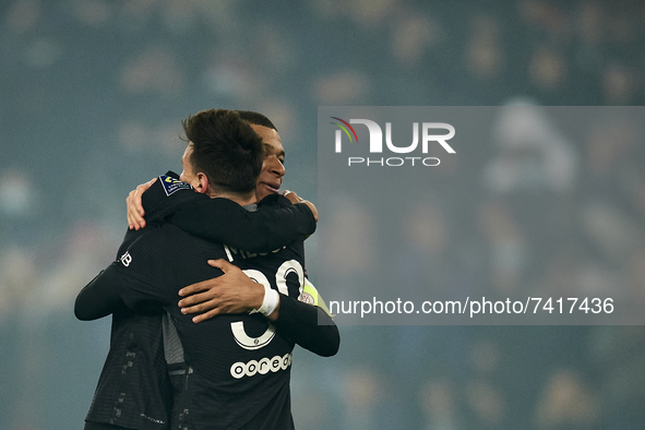 Leo Messi of PSG celebrates with Kylian Mbappe after scoring his sides first goal during the Ligue 1 Uber Eats match between Paris Saint Ger...