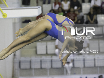 Francesca Zagaglini and Beatrice Atzei in action at Italian diving finals championship held in Turin, on April 4, 2014. (