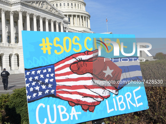 A sign is seen in front of Capitol during the press conference about November 15 Cuba protests today on November 16, 2021 at House Triangle/...