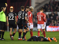 
Referee, Jeremy Simpson shows a yellow card for unsporting behaviour to Lyle Taylor of Nottingham Forest during the Sky Bet Championship ma...