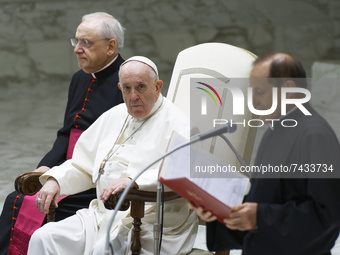 Pope Francis attends his weekly general audience in the Paul VI Hall at the Vatican, Wednesday, Nov. 24, 2021.  (