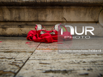 The red shoe, the symbol of this International Day for the Elimination of Violence against Women, on the fountain in Piazza Vittorio Emanuel...