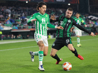 Hector Bellerin of Real Betis in action with Marijan Cabraja of Ferencarosi TC during the UEFA Europa League Group G stage match between Rea...