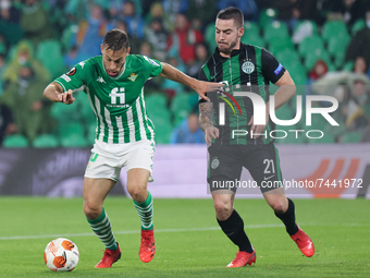 Sergio Canales of Real Betis in action with Endre Botka of Ferencarosi TC during the UEFA Europa League Group G stage match between Real Bet...