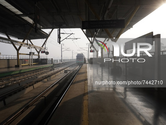 A Delhi metro train approaches towards a platform on a cold winter morning in New Delhi, India on November 26, 2021.  (