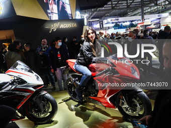 A model sits on the motorcycle at the MV Augusta exhibition during the EICMA motorcycle show in Milan, Italy on November 25, 2021. (