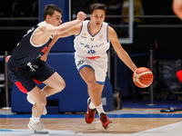 Alexander Khomenko (L) of Russia and Matteo Spagnolo of Italy in action during the FIBA Basketball World Cup 2023 Qualifying Tournament matc...