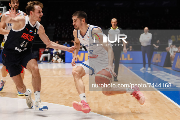 Artem Komolov (L) of Russia and Diego Flaccadori of Italy in action during the FIBA Basketball World Cup 2023 Qualifying Tournament match be...