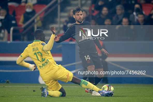 Juan Bernat of PSG and Dennis Appiah of Nantes compete for the ball during the Ligue 1 Uber Eats match between Paris Saint Germain and FC Na...
