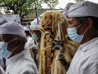 Balinese Hindu devotees attends the sacred ritual of Ngerebong amid COVID-19 pandemic in Kesiman Village, Denpasar, Bali, Indonesia on Novem...