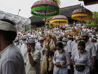 Balinese Hindu devotees attends the sacred ritual of Ngerebong amid COVID-19 pandemic in Kesiman Village, Denpasar, Bali, Indonesia on Novem...