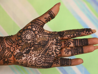 Hindu woman shows the beautiful Henna (mehndi) design on her hand as she waits for the henna to dry during the festival of Diwali in Toronto...