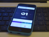 An iPhone displaying the home screen of the Beats 1 radio station, to a listener based in Stockport, England, on Monday 24th August 2015. Th...