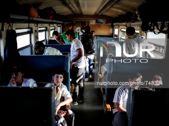 Refugees inside the train that will transport them to the Macedonian-Serbian border. Gevgelija on August 23, 2015. (Photo by Kostis Ntantami...