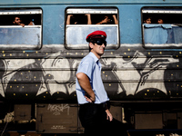 One of the train personnel outside the train full of refugees waiting to be transported to the Macedonian-Serbian border. Gevgelija on Augus...